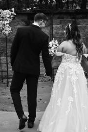 bride and groom holding hands